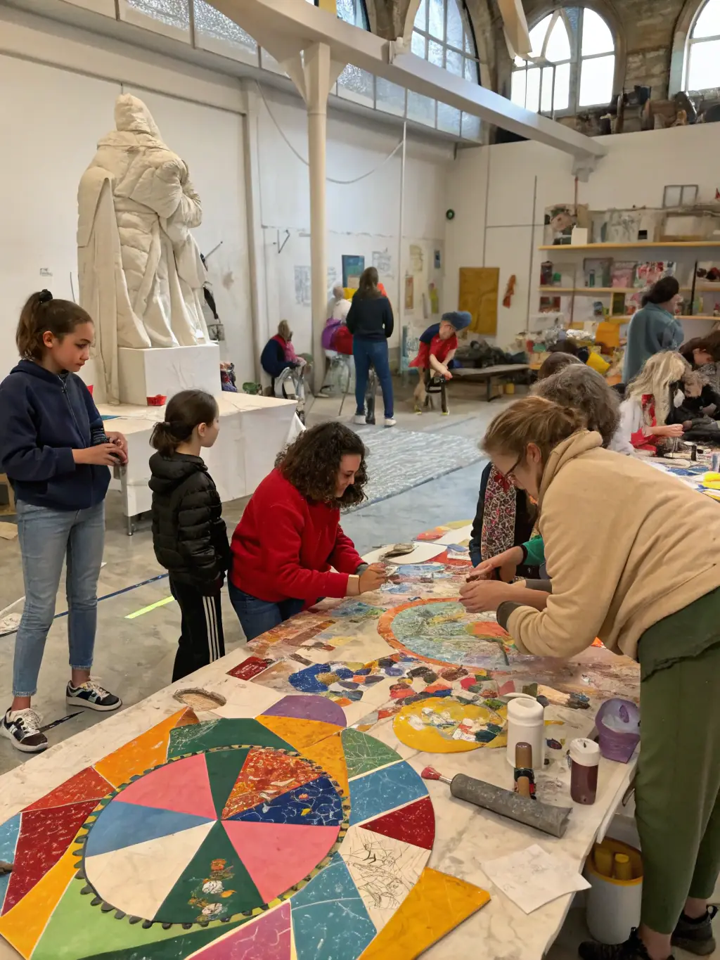 A photograph of a community workshop taking place at the priory, with participants actively involved in a hands-on activity, demonstrating the priory's dedication to community engagement.